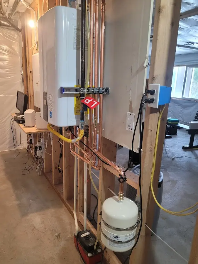 Licensed plumber repairing a kitchen sink in Clinton